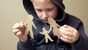 Kid holding a family paper figure